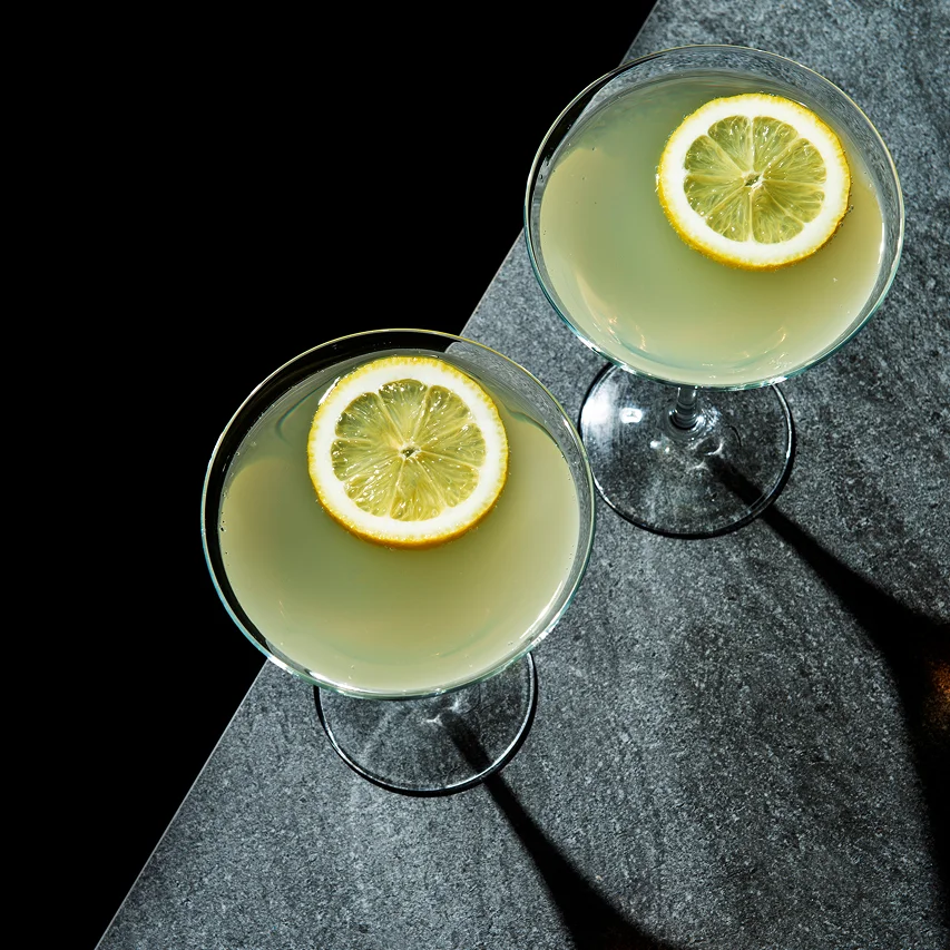 Blue Velvet Martini cocktail with a lime garnish